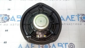 The left speaker on the rear shelf of a Honda Accord 13-17 is dented, with chips on the edge.