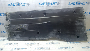 Left underbody protection for VW Jetta 19-24 is worn and dented.