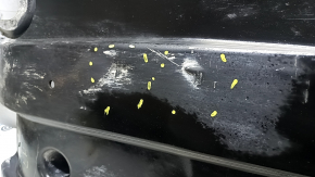 Left underbody protection for VW Jetta 19-24 is worn and dented.