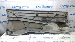 Left underbody protection for VW Jetta 19-24 is worn and dented.