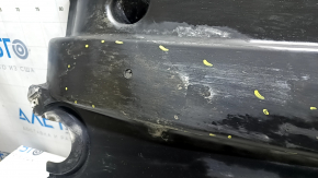 Right underbody protection for VW Jetta 19-24 is worn and dented.
