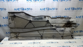 Right underbody protection for VW Jetta 19-24 is worn and dented.