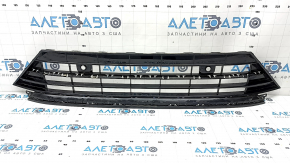 The lower grille of the front bumper, central, VW Tiguan 18-21, under parking sensors, R-Line, is cracked, sand