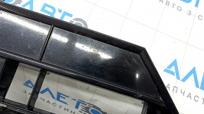 The lower grille of the front bumper, central, VW Tiguan 18-21, under parking sensors, R-Line, is cracked, sand