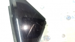 Triangle plug for the front left door of an Audi A4 B9 17-20, glossy black, scratches
