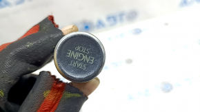 The Start-Stop button on a VW Tiguan 18-21 is worn and scratched.