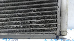 The air conditioner condenser radiator of the Toyota Prius V 12-17 has fallen out.
