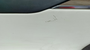 Tesla Model X 22-25 front left door panel, black, with white leather insert, scratches on plastic, tears in leather, broken fasteners, needs dry cleaning