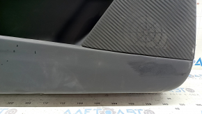 Tesla Model X 22-25 front left door panel, black, with white leather insert, scratches on plastic, tears in leather, broken fasteners, needs dry cleaning