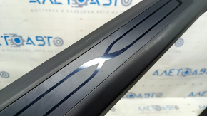 Tesla Model X 22-25 front left inner door sill trim: scratches, abrasions, broken fastener