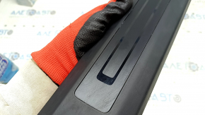 Tesla Model X 22-25 front right inner door sill plate with scratches and scuffs