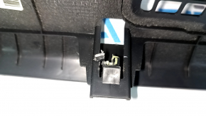 The lower front panel trim for the passenger footwell of a Hyundai Tucson 16-21 is black and the fastening is broken.