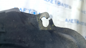 The rear left fender liner of a Toyota Prius 50 16-22 is torn.