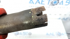 The right muffler tip of the Audi Q7 16-23 is rusted at the edge, missing a fragment.