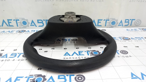 The steering wheel is bare, Hyundai Tucson 19-21, black rubber, cracked.