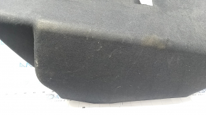 The front trunk liner of the Tesla Model X 22-25 is worn, needs dry cleaning, and is creased.