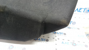The front trunk liner of the Tesla Model X 22-25 is worn, needs dry cleaning, and is creased.