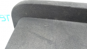 The front trunk liner of the Tesla Model X 22-25 is worn, needs dry cleaning, and is creased.