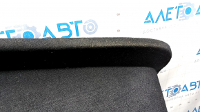The front trunk liner of the Tesla Model X 22-25 is worn, needs dry cleaning, and is creased.