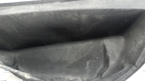 The front trunk liner of the Tesla Model X 22-25 is worn, needs dry cleaning, and is creased.