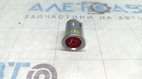 The rear left door lock button on a Tesla Model X 22-25 is cracked.