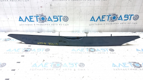 The trunk lid trim under the handle of a Ford Fusion mk5 19-20 has a broken guide.