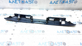 The trunk lid trim under the handle of a Ford Fusion mk5 19-20 has a broken guide.