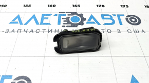 The left tailgate license plate light on a Jeep Grand Cherokee WL 21-25 has a broken mount.