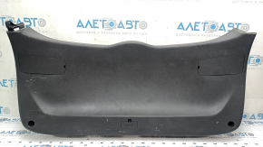 The lower trim panel of the tailgate of a Hyundai Tucson 16-21 is black, scratches, and the fastener is broken.