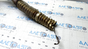The exhaust manifold with a catalytic converter for a Ford Fusion mk5 17-20 hybrid is rusty and missing a fragment.