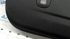 Jeep Grand Cherokee WL 22-25 black lower tailgate trim for speakers, with lamps, broken fasteners, worn, whitened plastic
