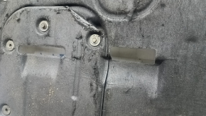The engine protection of the Hyundai Tucson 16-21 is worn, torn, and dented.