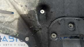 The engine protection of the Hyundai Tucson 16-21 is worn, torn, and dented.
