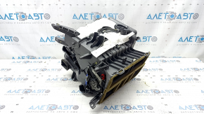 The bare heater housing of a Kia Optima 2016-2018 air conditioner.