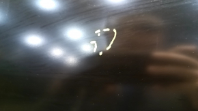 The front left door of a Ford Fusion mk5 13-20 China is bare and dented.