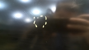 The front left door of a Ford Fusion mk5 13-20 China is bare and dented.