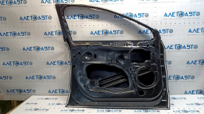 The front left door of a Ford Fusion mk5 13-20 China is bare and dented.