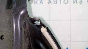 The front left door of a Ford Fusion mk5 13-20 China is bare and dented.