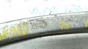 Tesla Model X 22-25 lower left front control arm has a torn boot.