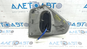The outer left fender light of a Lexus RX350 RX400h 06-07 is dark and scratched.