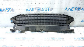 The lower radiator deflector on a Honda Clarity 18-21 USA is torn.