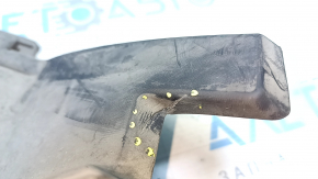 The lower radiator deflector on a Honda Clarity 18-21 USA is torn.