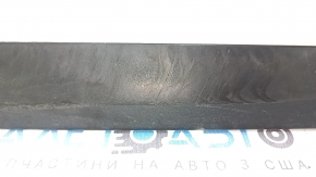 Tesla Model X 22-25 lower front right door trim is worn, glue is missing