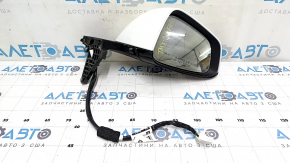 The right side mirror assembly for a Tesla Model X 22-25 is worn and scratched.