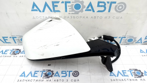 The right side mirror assembly for a Tesla Model X 22-25 is worn and scratched.