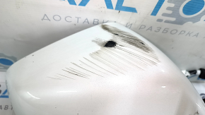 The right side mirror assembly for a Tesla Model X 22-25 is worn and scratched.