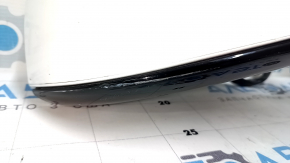 The right side mirror assembly for a Tesla Model X 22-25 is worn and scratched.