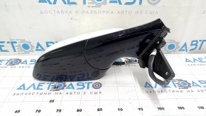 The right side mirror assembly for a Tesla Model X 22-25 is worn and scratched.