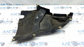 The front left fender liner, lower part, BMW X5 G05 19-24, is dented.