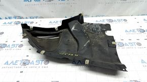 The front right fender liner, lower part, BMW X5 G05 19-23, is dented and torn.